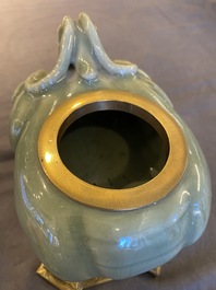 Een Chinese Longquan celadon wierookbrander in de vorm van een luduan met vergulde bronzen montuur, Ming