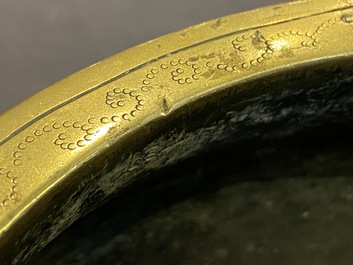 A Chinese bronze censer with floral relief design, Xuande mark, 18/19th C.