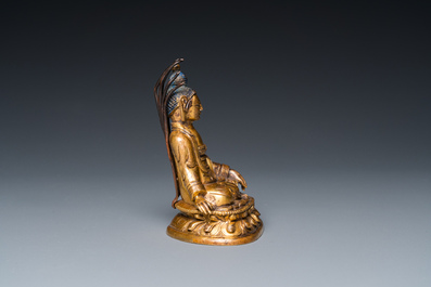 A small Sino-Tibetan gilt bronze Buddha, 19th C.