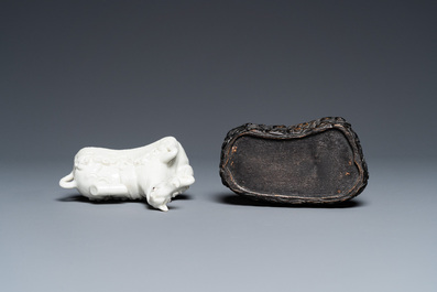 A Chinese white-glazed brush rest in the shape of a resting horse in a wavy sea, 18th C.