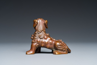 A Chinese bronze 'Buddhist lion' scroll weight, Qing