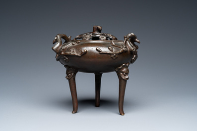 A Chinese bronze tripod censer and cover, 19th C.