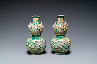 A pair of Chinese famille verte double gourd vases and a blue and white vase and cover, 19/20th C.