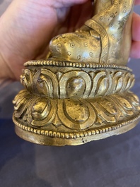 A Sino-Tibetan gilt bronze Buddha, 18th C.