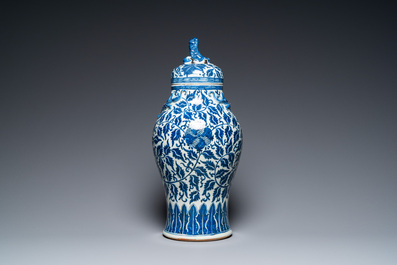 A pair of Chinese famille verte double gourd vases and a blue and white vase and cover, 19/20th C.