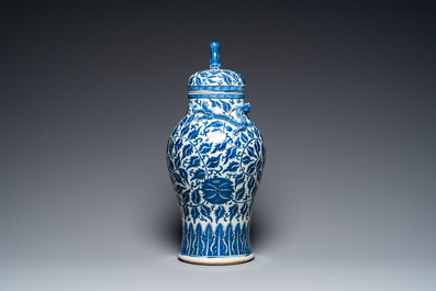 A pair of Chinese famille verte double gourd vases and a blue and white vase and cover, 19/20th C.