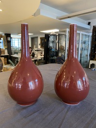 A pair of Chinese monochrome copper-red bottle vases, 19th C.