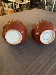 A pair of Chinese monochrome copper-red bottle vases, 19th C.