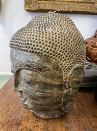 A Chinese Ming-style carved stone head of Buddha, 19/20th C.
