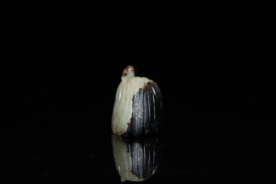 A Chinese carved black and celadon jade model of a crane, Qing