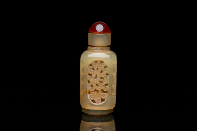 A Chinese reticulated and movable celadon jade snuff bottle, Qing