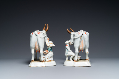 A pair of cold-painted white Dutch Delft cow milkers' groups, 18th C.