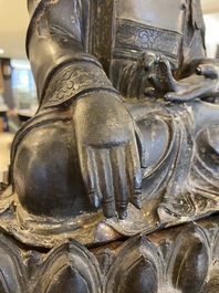 A large Sino-Tibetan gilt bronze Buddha on lotus throne, Ming