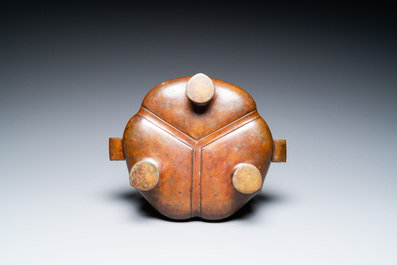 A Chinese lotus-shaped bronze tripod censer, late Ming or early Qing