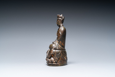 A Sino-Tibetan gilt-lacquered bronze figure of Buddha, late Ming or early Qing