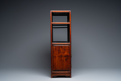 A small Chinese open-worked carved wooden cabinet with marble insets, 19th C.