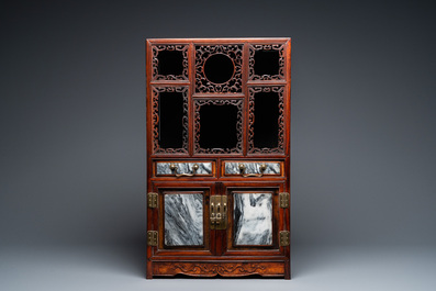 A small Chinese open-worked carved wooden cabinet with marble insets, 19th C.