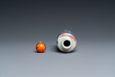 A Chinese blue, white and copper-red snuff bottle, 19th C.