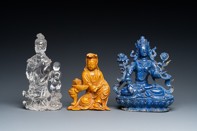 A Chinese lapis lazuli sculpture of Buddha and two of Guanyin in rock crystal and soapstone, 19/20th C.