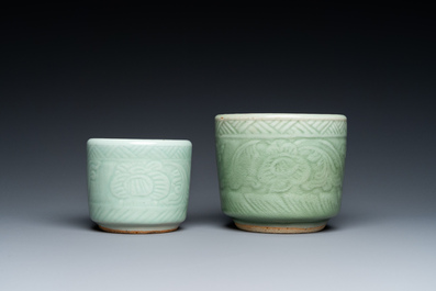 Two Chinese celadon-glazed brush pots with underglaze design, 19th C.