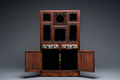 A small Chinese open-worked carved wooden cabinet with marble insets, 19th C.