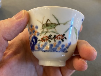 A pair of Chinese famille verte 'grasshopper' teacups, Kangxi mark but probably laer