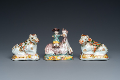 Three polychrome and cold-painted Dutch Delft miniatures of a buckrider and two cows, 18th C.