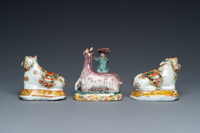 Three polychrome and cold-painted Dutch Delft miniatures of a buckrider and two cows, 18th C.