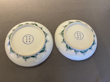 A pair of Chinese doucai 'dragon' plates, Chenghua mark, Kangxi