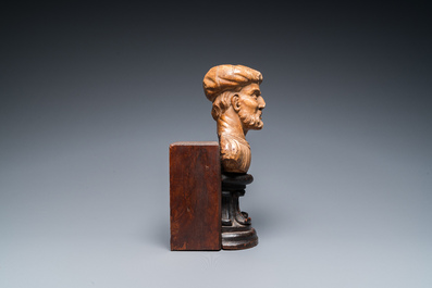 An Italian alabaster bust of a bearded man on a later wooden stand, 16th C.