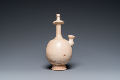 A Chinese cream-white-glazed stoneware kundika, probably Tang