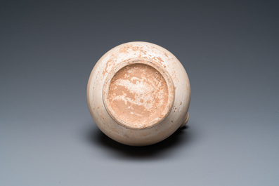 A Chinese cream-white-glazed stoneware kundika, probably Tang