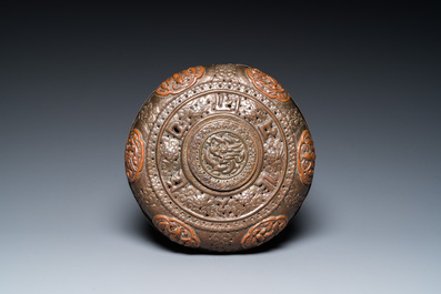 A Tibetan pierced and repouss&eacute; copper scent box and cover with inscribed mantra, 18/19th C.