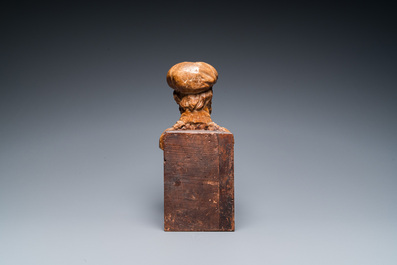 An Italian alabaster bust of a bearded man on a later wooden stand, 16th C.