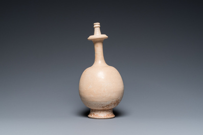 A Chinese cream-white-glazed stoneware kundika, probably Tang