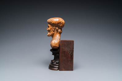 An Italian alabaster bust of a bearded man on a later wooden stand, 16th C.