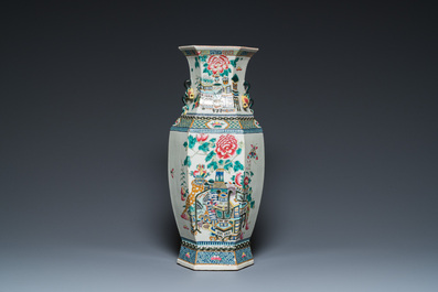 A hexagonal Chinese famille rose vase with antiquities and peacocks, 19th C.