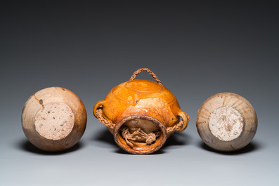 Two German stoneware bellarmine jugs and a pilgrim's flask, 17th C.