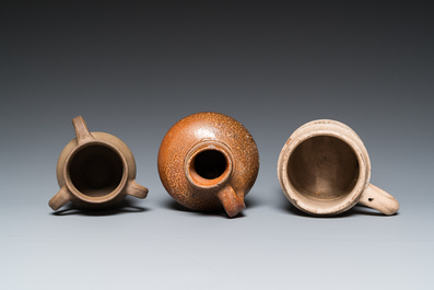 A German stoneware mug and two jugs, Raeren and Cologne, 16/17th C.