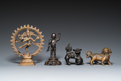 Two Chinese bronze Buddhist lions and a standing infant Buddha, Ming and later