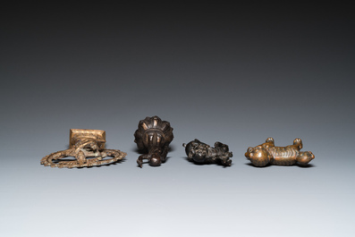 Two Chinese bronze Buddhist lions and a standing infant Buddha, Ming and later