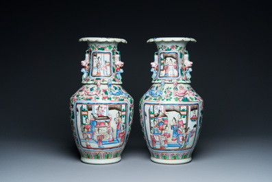 A pair of Chinese famille rose 'court scene' vases, 19th C.