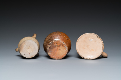 A German stoneware mug and two jugs, Raeren and Cologne, 16/17th C.