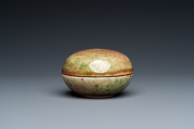 A Chinese peachbloom-glazed seal paste box, Kangxi mark, 19th C.