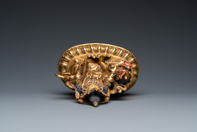 A Tibetan gilt bronze group of Jambhala on his lion, 19/20th C.