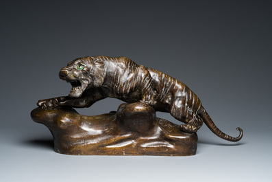 A large Vietnamese bronze tiger on a carved wooden stand, 19/20th C.