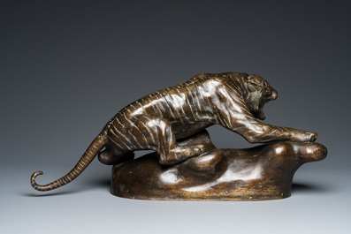 A large Vietnamese bronze tiger on a carved wooden stand, 19/20th C.