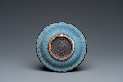 A small Chinese black-glazed double gourd vase and a blue crackle-glazed saucer dish, Qing