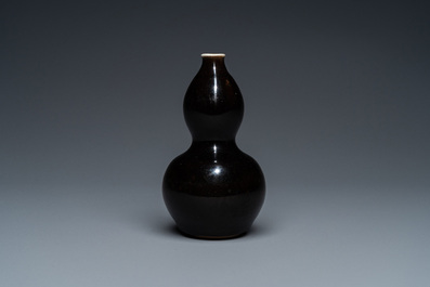 A small Chinese black-glazed double gourd vase and a blue crackle-glazed saucer dish, Qing