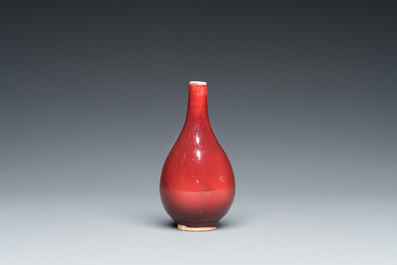 A small Chinese sang-de-boeuf-glazed bottle vase, Xuande mark, Qing